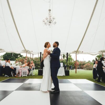 sailcloth wedding reception tent with black and white dance floor